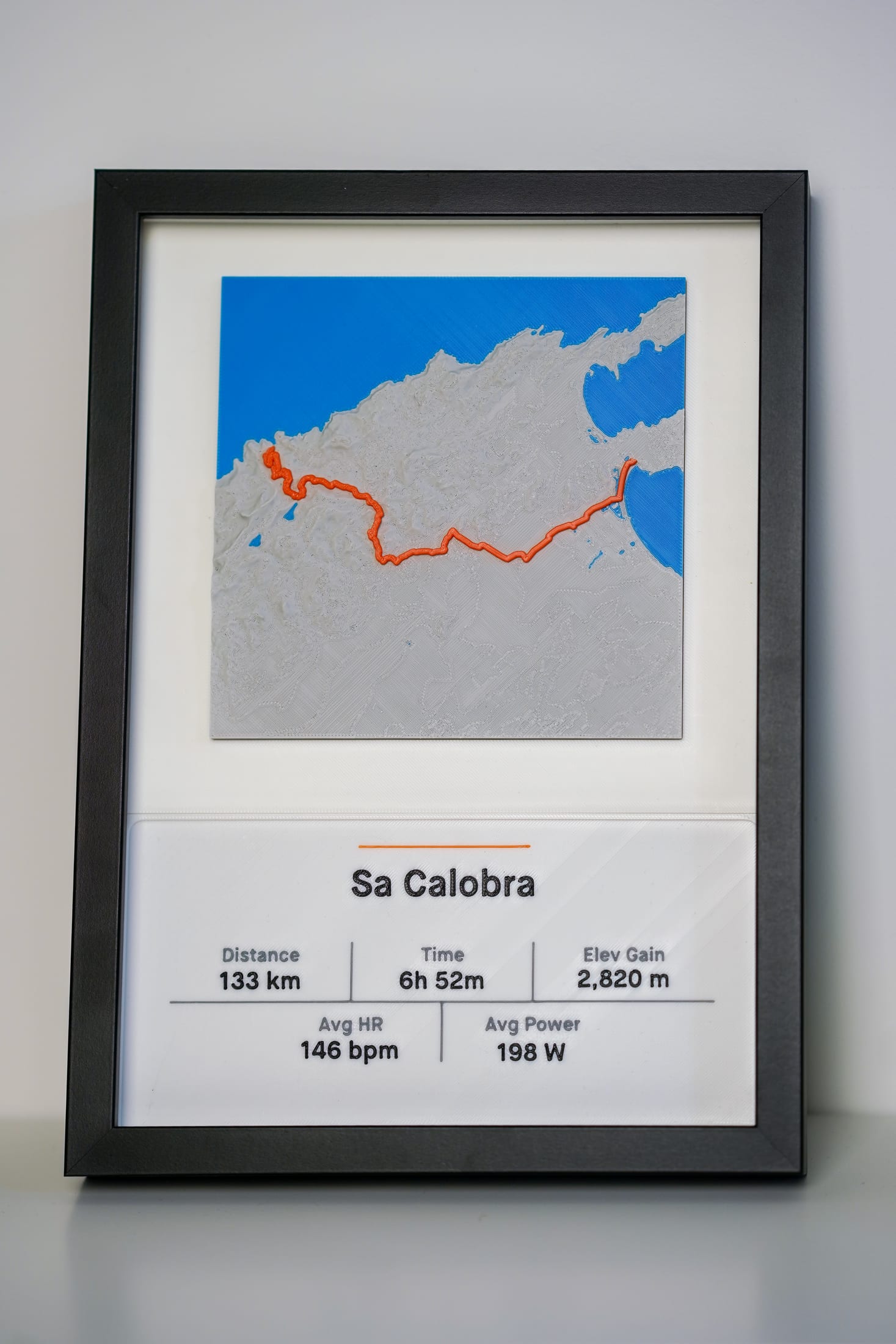 Straight-on photograph of the framed Sa Calobra minimal relief version.