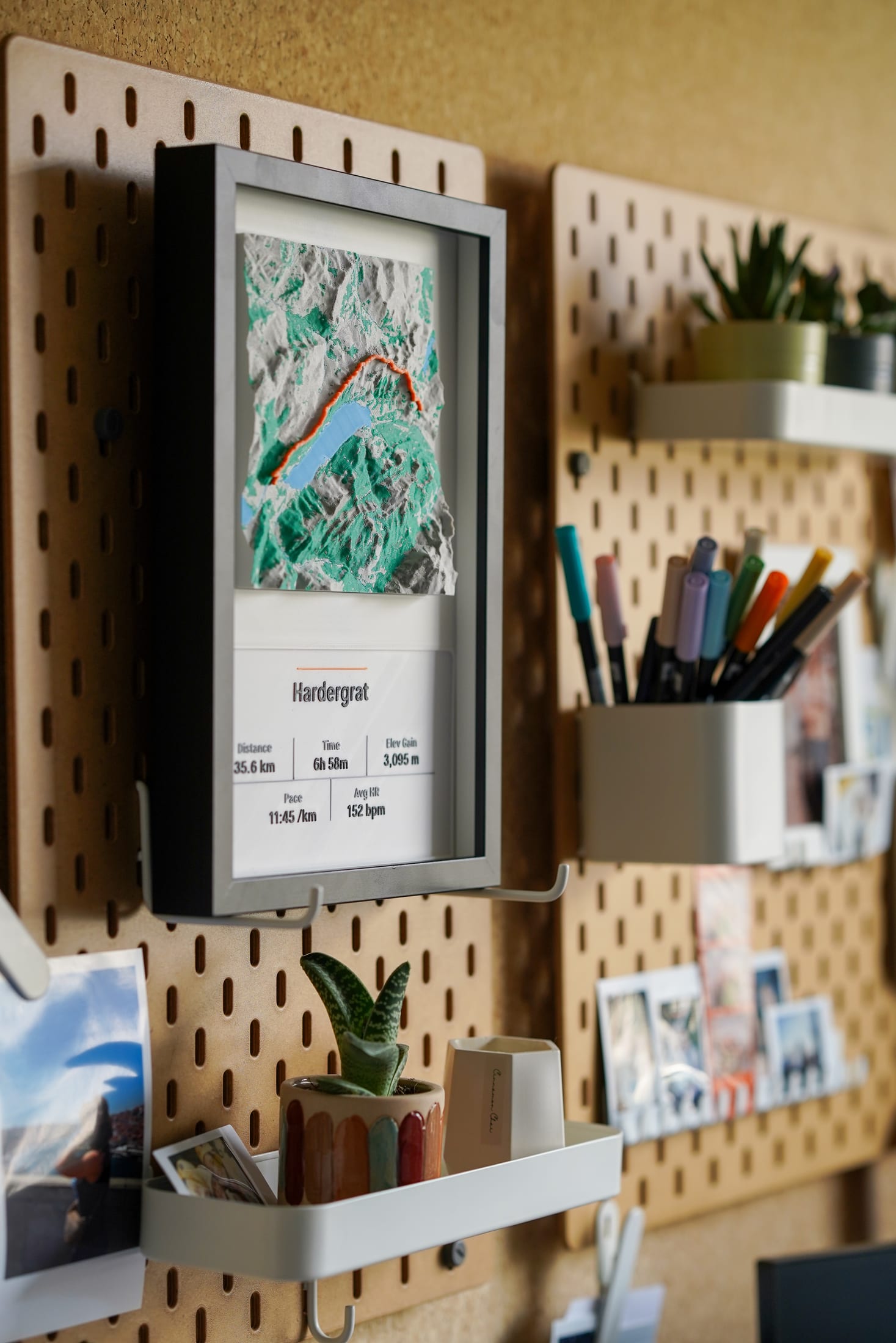 Side-angle photograph of the Hardergrat piece mounted on a pegboard workspace.